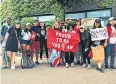  ??  ?? Praising the almighty: These United by Rog devotees follow their idol Federer (right)