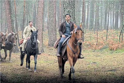  ??  ?? Christian Bale, left, and Oscar Isaac in a scene from The Promise.