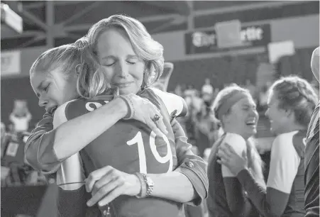  ??  ?? Erin Moriarty, left, and Helen Hunt appear in a scene from The Miracle Season. It’s a formulaic but rousing tale of teamwork, girl power and community, and a tearjerker to boot.