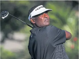  ??  ?? Vijay Singh plays a shot during the first round of the Sony Open.