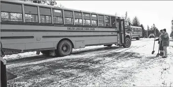  ?? P.E.I. RCMP/SPECIAL TO THE GUARDIAN ?? No injuries were reported after two school buses and a tow truck became stuck in icy conditions Friday morning on the Johnston Road.