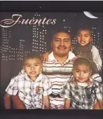  ??  ?? A PHOTO of Luis Fuentes and his sons hangs in the family’s home in South L.A. The boys’ mother died suddenly in 2008.