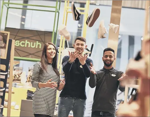  ??  ?? FEET FIRST: Staff at the schuh store in The Broadway, Bradford, who are waiting to receive old and unwanted shoes from customers as part of a charity campaign.