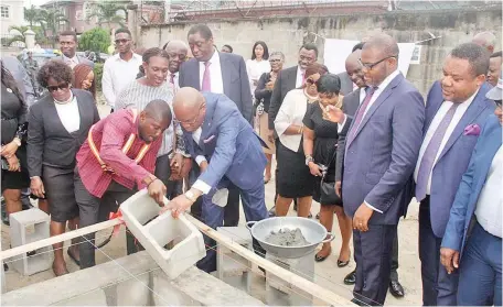  ??  ?? Mr. Paul Usoro, SAN laying the foundation, while Dr. Wale Babalakin, SAN and Mr. Chuka Ikwuazom look on