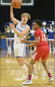  ?? JENNIFER FORBUS — FOR THE MORNING JOURNAL ?? Midview’s Bryce Newton hooks the ball over his shoulder and Oberlin defender Marius Harrell to pass it off to a teammate.