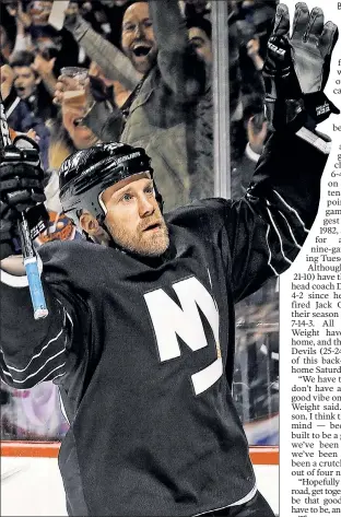  ?? Getty Images ?? LEAVE HOME: Jason Chimera celebrates his third-period goal Sunday night against the Devils. The Islanders continued their hot play at home, but embark on a nine-game road trip Tuesday in Detroit.