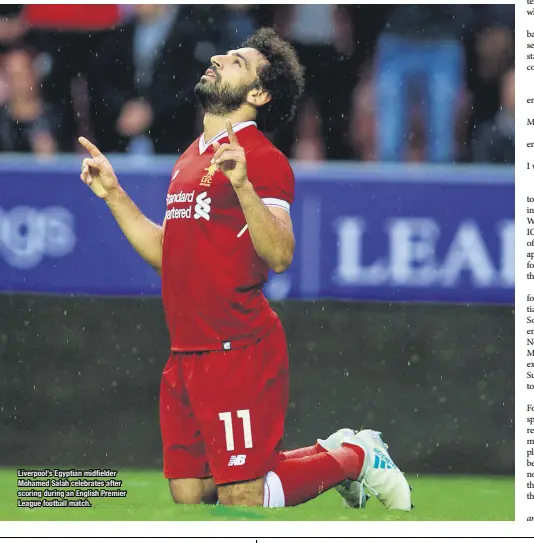  ??  ?? Liverpool’s Egyptian midfielder Mohamed Salah celebrates after scoring during an English Premier League football match.