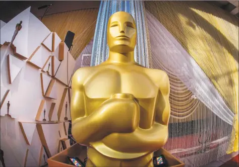  ?? Mark Ralston / AFP via Getty Images ?? An Oscars statue is displayed on the red carpet area on the eve of the 92nd Oscars ceremony at the Dolby Theatre in Hollywood, Calif., on Saturday