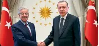  ?? AP ?? Turkey’s President Recep Tayyip Erdogan shakes hands with Foreign Minister Khawaja Asif prior to their talks at the Presidenti­al Palace in Ankara. —