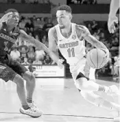  ?? ALEX MENENDEZ/GETTY IMAGES ?? Florida guard Chris Chiozza drives past Incarnate Word’s Jalin Hart. Chiozza scored 16 points against the Cardinals.