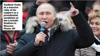  ??  ?? Vladimir Putin at a massive rally of his support as a presidenti­al candidate at the Luzhniki Stadium in Moscow. Photo: AP