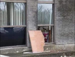  ??  ?? The smashed window at the side of the Bank of Ireland building in Taghmon.