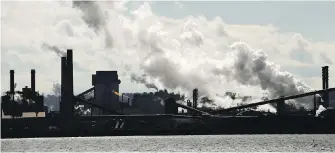  ??  ?? Steel mills on the Hamilton waterfront release emissions.