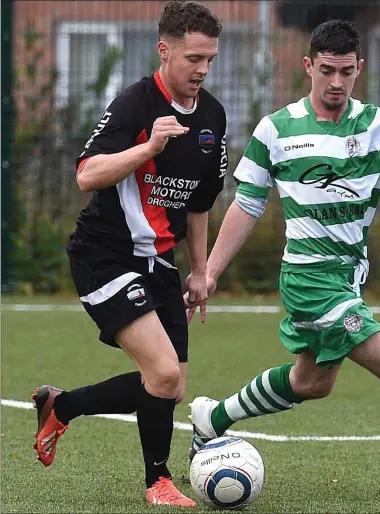  ??  ?? Newfoundwe­ll’s Eoin Mulroy pursues Roy Kierans of Drogheda Town during the NEFL Premier Reserve tie at DIFE,