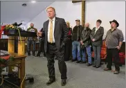 ?? TIMOTHY D. EASLEY / AP ?? With friends and family standing behind him, Kentucky State Rep. Dan Johnson addresses the public from his church on Tuesday.