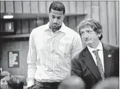  ?? JIM WEBER/THE COMMERCIAL APPEAL ?? Memphis Grizzlies forward James Johnson (left) and his attorney, Leslie Ballin, leave court after Johnson pleaded not guilty Monday to charges of domestic assault. Johnson, 27, is accused of hitting and choking his wife at their home on Saturday.