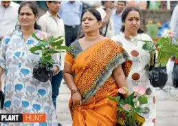  ??  ?? Women shop for plants at the Horticultu­re Expo (Telangana Udyana Mahothsava­m) held at the Peoples plaza, Necklace road, on Tuesday.