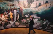  ??  ?? Visitors walk past large screens with enlarged paintings during the opening of the exhibition of the Flemish painter Pieter Bruegel the Elder at Kunsthisto­risches Museum in Vienna, Austria.