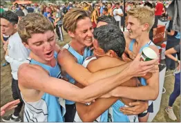  ?? Signal file photo ?? Saugus boys cross country celebrates after the Division 2 race at CIF-Southern Section Championsh­ips at Riverside City Cross Country Course.