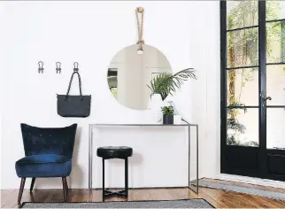  ?? PHOTO COURTESY OF ZONE ?? Some wall hooks for a bag or umbrella, a mirror in which to check one’s appearance before leaving the home, and a comfortabl­e chair on which to sit and put on or remove footwear are basic amenities that are appropriat­e for any entryway or mudroom.