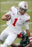  ?? Associated Press ?? Ohio State’s Justin Fields ran for two touchdowns and passed for two against Michigan State.