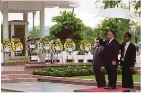 ??  ?? Deputy Chief Minister Tan Sri Joseph Pairin Kitingan (second from right) at the memorial service.