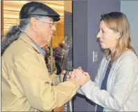  ?? NANCY KING/CAPE BRETON POST ?? Eskasoni elder Albert Marshall declared that Sarah Midanik, CEO of the Downie Wenjack Fund, has been adopted by the Mi’kmaq people of Unama’ki following the opening of the Chanie Wenjack legacy room at Cape Breton University’s library Friday.