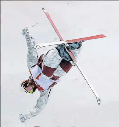  ?? [KIN CHEUNG/THE ASSOCIATED PRESS] ?? Mikael Kingsbury of Canada executes a jump during his run to the men’s moguls gold medal at Phoenix Snow Park.