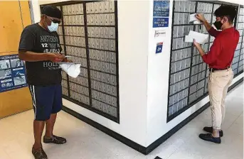  ?? Molly Hennessy-Fiske / Los Angeles Times ?? Franklin Crump, 64, a retired Army veteran who also worked for the Postal Service, checks his mail Wednesday at the post office in Kendleton, southwest of Houston.