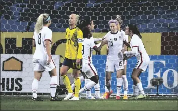  ?? JANERIK HENRIKSSON ?? MEGAN RAPINOE (15) OF USA CELEBRATES with teammates after scoring a goal on a penalty kick during the women’s internatio­nal friendly soccer match between Sweden and USA at Friends Arena in Stockholm, Sweden Saturday.