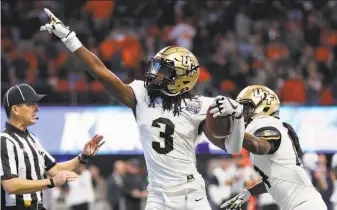  ?? Kevin C. Cox / Getty Images ?? Central Florida’s Antwan Collier knows the Knights are pointed in the right direction after he intercepte­d an Auburn pass in the fourth quarter of the Peach Bowl in Atlanta.