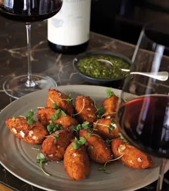  ??  ?? Below: aubergine chickpea fritters paired with a smoky St Laurent red from Austria