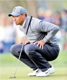  ??  ?? Tiger Woods looks over a shot on the 16th hole during the first round of the Valspar Championsh­ip at Innisbrook Resort Copperhead course on March 8, 2018 in Palm Harbor, Florida. - AFP PHOTO