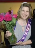  ??  ?? Image made from video, Deana Michalak smiles after being named queen of the Mom Prom at St Thomas a’Becket Catholic Church in Canton Township, Mich.