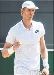  ??  ?? South Africa’s Kevin Anderson celebrates after winning men’s singles quarter-final against Switzerlan­d’s Roger Federer (R).