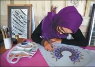  ?? WAKIL KOHSAR / AGENCE FRANCE-PRESSE ?? An Afghan student practices during a calligraph­y class at the Turquoise Mountain Foundation in Mourad Khani in the old city of Kabul.