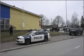  ?? (AP/Lehtikuva/Markku Ulander) ?? Responders secure the scene at Viertola comprehens­ive school, in Vantaa, Finland, on Tuesday.