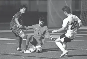  ?? ?? Olympic Heights’ Antonio Andrade rushes out of the box to claim a loose ball during a regional quarterfin­als match against Jupiter on Tuesday.