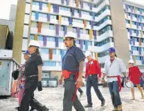  ?? Bob Owen / Staff file photo ?? In 2017, Christus Santa Rosa Health System worked with Ramón Vásquez, center, when remains were found on its property.