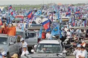  ?? AFP PIC ?? Supporters of Cambodia National Rescue Party gathering during an election campaign in Phnom Penh yesterday.