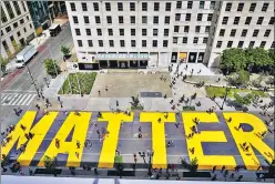  ?? REUTERS ?? ■
Protesters painted Black Lives Matter on a street near the White House in Washington, DC.