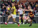  ?? Photograph: David Mariuz/AAP ?? Richmond’s Dustin Martin and Andrew McPherson of the Crows during the final round game at Adelaide Oval.