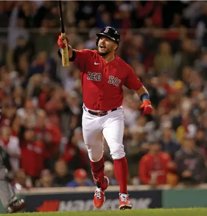  ?? STuART cAHiLL / HeRALd sTAFF ?? QUITE THE ADDITION: Kyle Schwarber celebrates after hitting a solo home run in the third inning off of Yankees starter Gerrit Cole in last night’s AL Wild Card Game at Fenway Park.