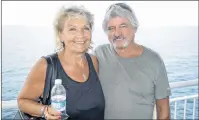  ?? JEREMY FRASER/CAPE BRETON POST ?? Tina Huszar, left, and husband, Brian Store, stand on the MV Highlander­s deck during an Aug. 7 crossing between North Sydney and Port aux Basques, N.L. The couple was traveling to Newfoundla­nd on vacation to visit Huszar’s stepfather and sister.