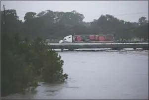  ?? The Associated Press ?? BETA: Brays Bayou gets dangerousl­y high near the Texas Medical Center during Tropical Storm Beta Tuesday, in Houston.