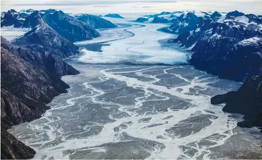  ?? (Hannibal Hanschke/Reuters) ?? THE MELTING Sermeq glacier, located around 80 km. south of Nuuk, is photograph­ed in this aerial over Greenland, last September. Since last Rosh Hashanah, Greenland has lost 250 billion tons of ice.