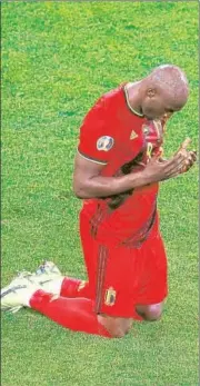 ?? AFP ?? Romelu Lukaku prays at the end of a Group B match.