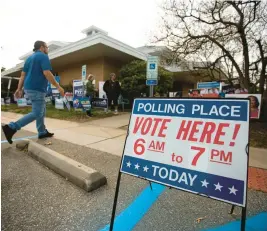 ?? BILLY SCHUERMAN/STAFF ?? Voters head to the polls at the Mary D. Pretlow Anchor Branch Library in the Ocean View neighborho­od of Norfolk on Tuesday.