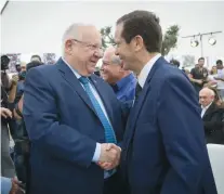  ?? (Miriam Alster/Flash90) ?? PRESIDENT REUVEN Rivlin and incoming president Isaac Herzog.