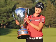  ??  ?? Sung Hyun Park of Korea celebrates with the trophy after winning the Canadian Pacific Women’s Open following the final round at the Ottawa Hunt & Golf Club on August 27, 2017 in Ottawa, Canada. - AFP photo